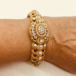 Bracelet montre en or et diamants signé REGNIER vers 1960